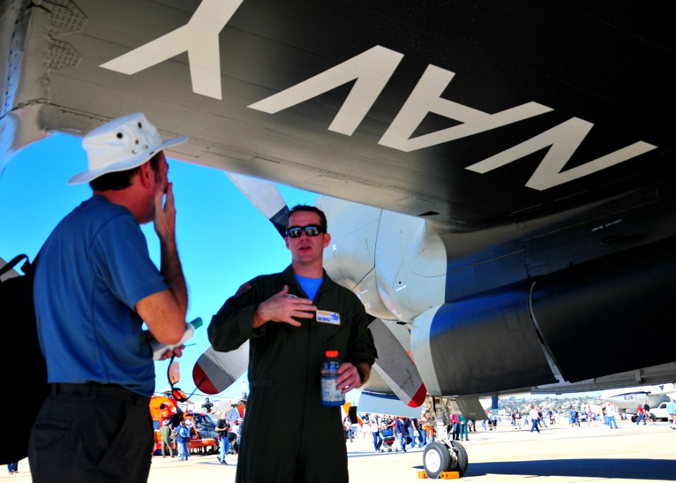 US Navy 110212-N-ZS026-133 Naval Aircrewman 1st Class Dave McGinty, assigned to the Golden Eagles of Patrol Squadron (VP) 9 explains the mission of