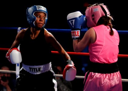 US Navy 110215-N-2610F-097 Master-at-Arms Seaman Rhonda McGee, left, spars with Patricia Cuevas during an exhibition match in the preliminary round photo