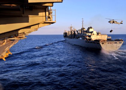US Navy 110213-N-0569K-026 The Military Sealift Command fast combat support ship USNS Arctic (T-AOE 8) transits alongside the aircraft carrier USS