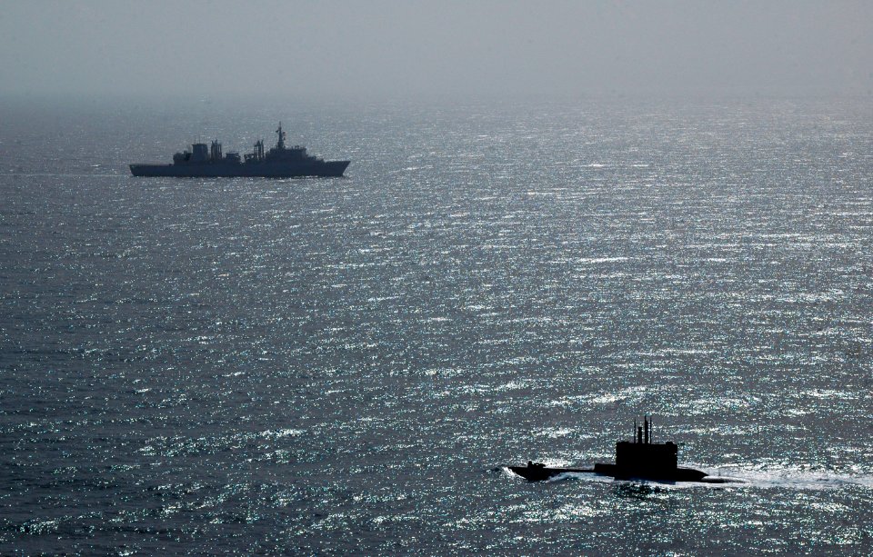 US Navy 110217-O-0000X-033 NATO ships and aircraft force the Greek navy submarine HS Protefs (S 113) to surface off the coast of Sicily during Exer