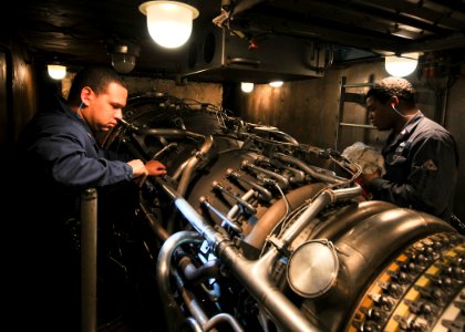 US Navy 110215-N-9793B-015 Sailors check a gas turbine engine aboard the guided-missile cruiser USS Anzio (CG 68)