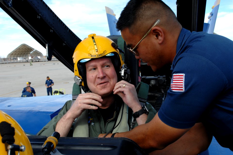 US Navy 110215-N-IR859-005 Vice Adm. Allen G. Myers, commander of U.S. Naval Air Forces, is strapped into an F-A-18 Hornet, assigned to the U.S. Na