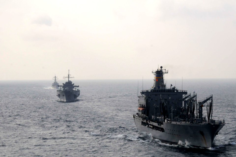 US Navy 110218-N-9094S-145 The Military Sealift Command fleet replenishment oiler USNS Tippecanoe (T-AO 199), right, the U.S. 7th Fleet command shi