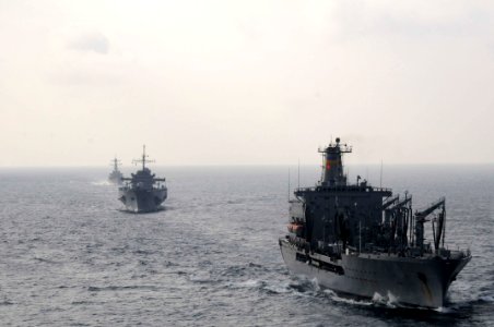 US Navy 110218-N-9094S-145 The Military Sealift Command fleet replenishment oiler USNS Tippecanoe (T-AO 199), right, the U.S. 7th Fleet command shi