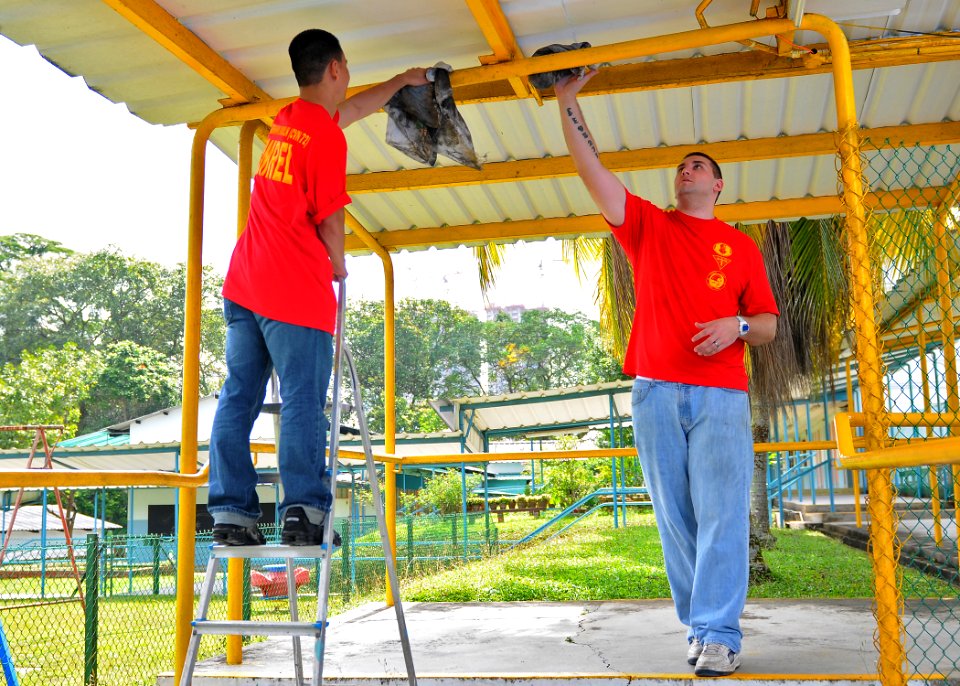 US Navy 110218-N-DX615-148 Sailors clean railings during a community service project at the Singapore Association for the Visually Handicapped