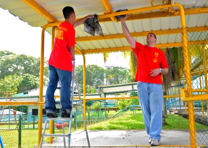 US Navy 110218-N-DX615-148 Sailors clean railings during a community service project at the Singapore Association for the Visually Handicapped