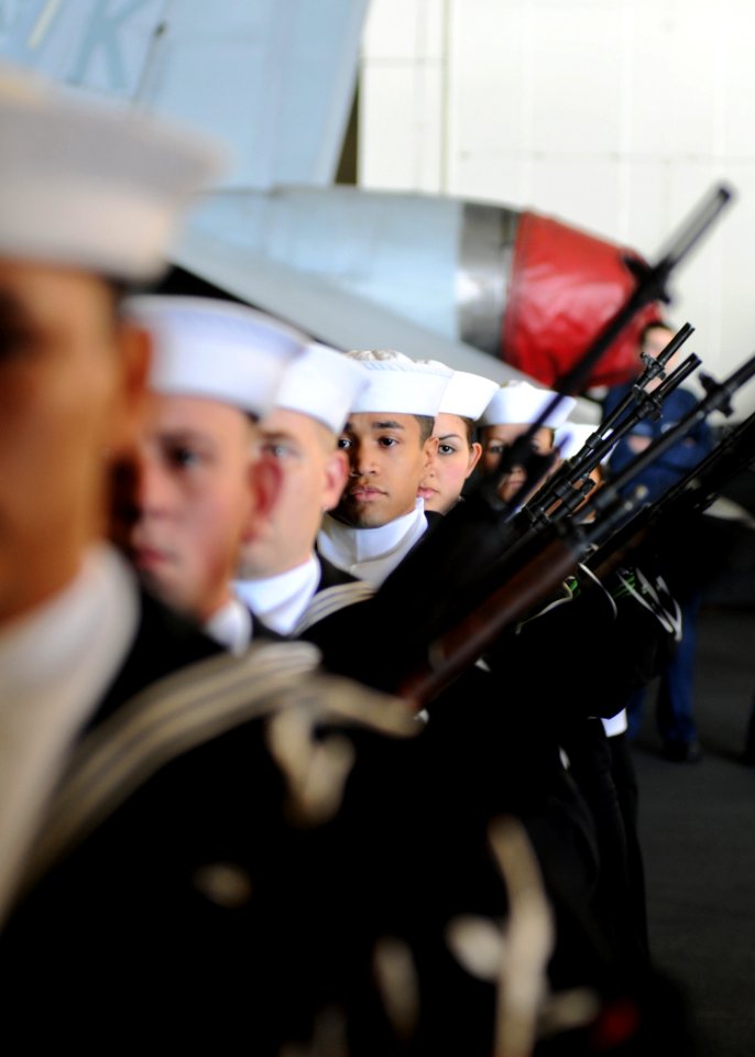 US Navy 110214-N-4590G-156 Members of the honor guard aboard the aircraft carrier USS Ronald Reagan (CVN 76) prepare for a burial at sea ceremony