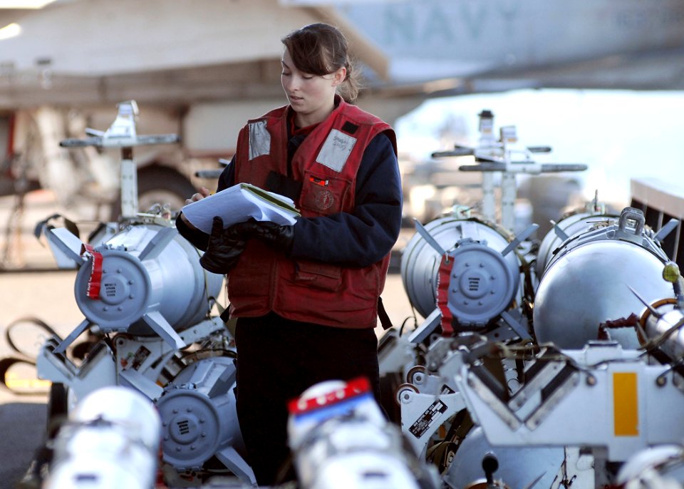US Navy 110217-N-DM338-087 Aviation Ordnanceman 3rd Class Shirley Shugar takes inventory of ordnance in the bomb farm aboard USS Ronald Reagan (CV