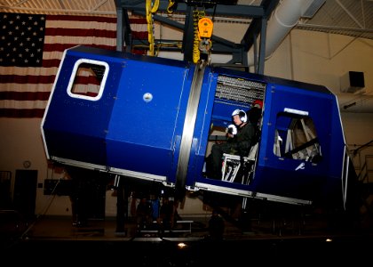 US Navy 110215-N-ZK021-003 Sailors prepare to be submerged in a modular egress training system during a simulated helicopter crash at the Aviation