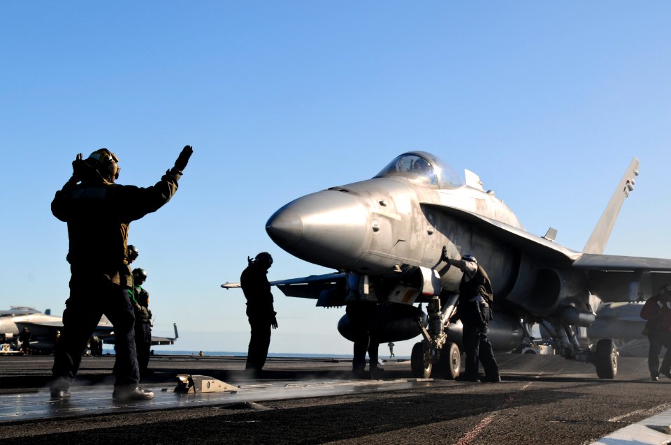 US Navy 110217-N-IC111-248 Sailors assigned to the aircraft carrier USS Ronald Reagan (CVN 76) guide an F-A-18E Super Hornet assigned to the Argona
