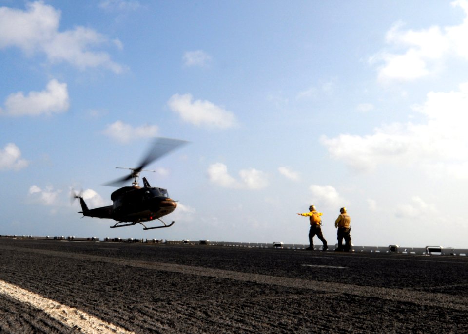 US Navy 110216-N-4743B-042 Sailors direct a Royal Thai Navy Bell 212 helicopter aboard USS Essex (LHD 2)