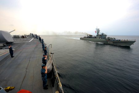 US Navy 110221-N-0176M-005 Sailors aboard the guided-missile destroyer USS Higgins (DDG 76) render honors as the Royal Thai Navy frigate HTMS Bangp
