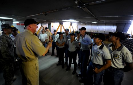 US Navy 110215-N-WX845-092 Cmdr. Mark Becker gives a tour of High Speed Vessel Swift (HSV 2) to students from Instituto Capitan De Navio Dem Cesar