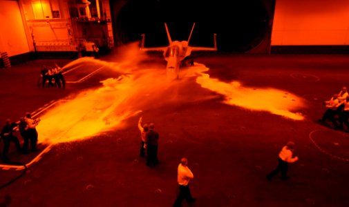 US Navy 110221-N-TB177-141 Sailors aboard USS George H.W. Bush (CVN 77) participate in a fire drill exercise in the ship's hangar bay