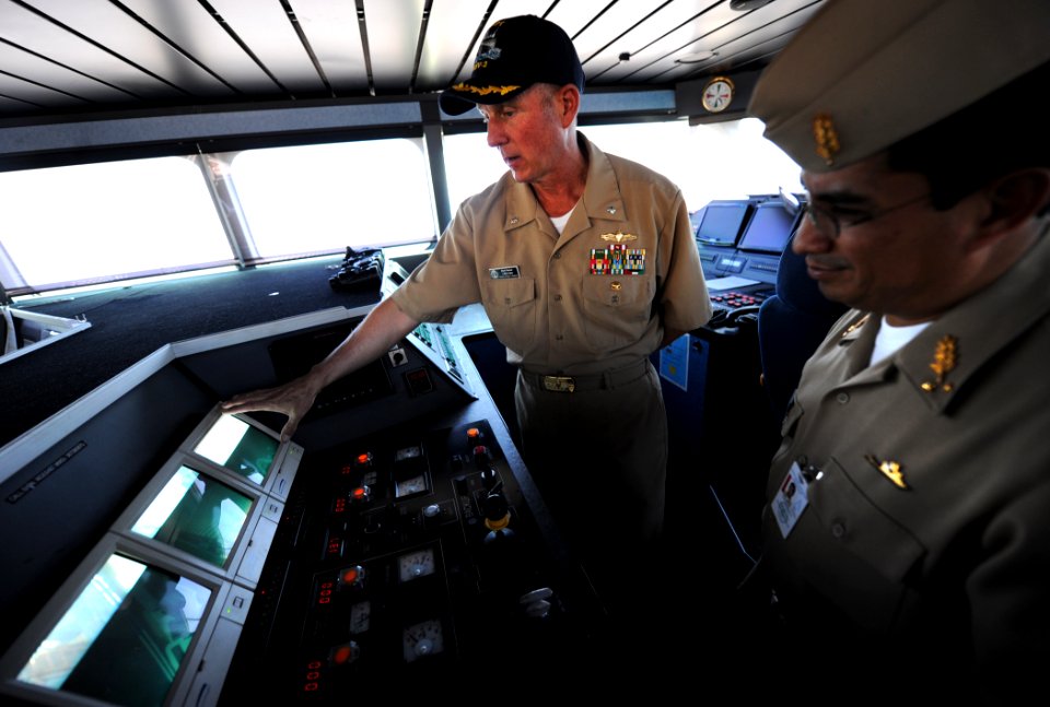US Navy 110218-N-EC642-276 Cmdr. Mark Becker, left, demonstrates the camera system aboard High Speed Vessel Swift (HSV 2) to Contralmirante Juan An