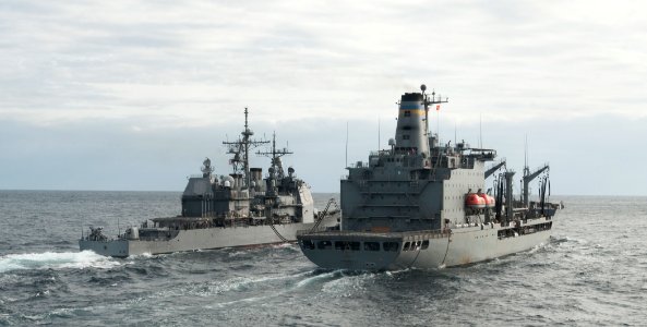 US Navy 110216-N-9589S-052 The guided-missile cruiser USS Monterey (CG 61), left, conducts an underway replenishment with the Military Sealift Comm