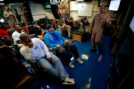 US Navy 110216-N-DR144-080 Members of the Green Bay Packers football team listen as Lt. Christopher Viernes gives a presentation about Strike Fight photo