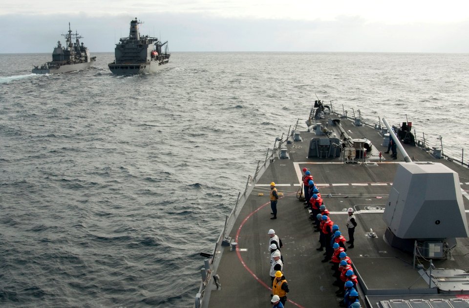 US Navy 110216-N-9589S-028 Sailors aboard the Arleigh Burke-class guided-missile destroyer USS Truxtun (DDG 103) stand by as they approach the Mili