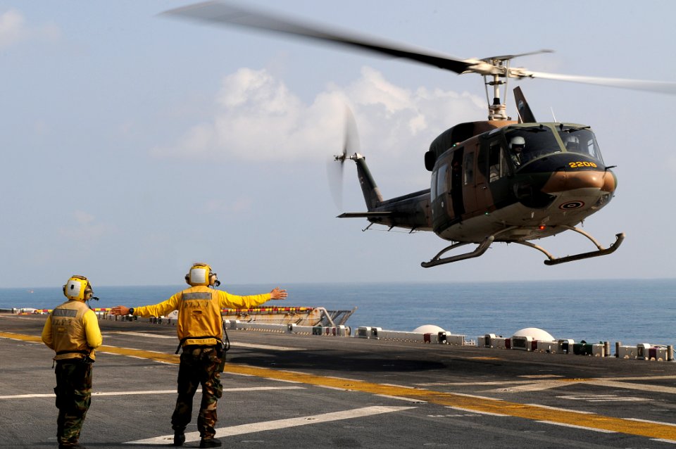 US Navy 110216-N-4743B-095 Sailors direct a Royal Thai Navy Bell 212 helicopter aboard USS Essex (LHD 2)