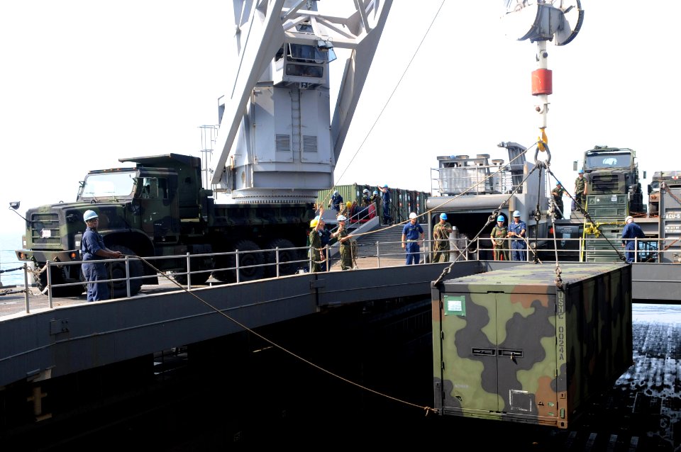 US Navy 110219-N-6692A-074 Sailors and Marines assigned to the 31st Marine Expeditionary Unit (31st MEU) load equipment aboard the amphibious trans