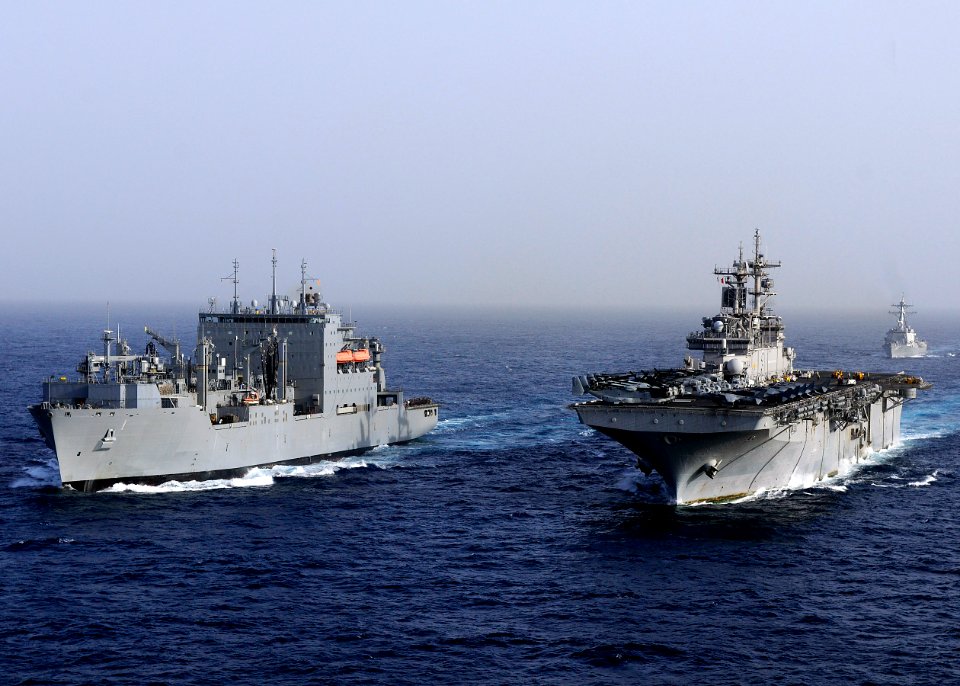 US Navy 110216-N-3154P-563 The amphibious assault ship USS Kearsarge (LHD 3), right, and the Military Sealift Command dry cargo and ammunition ship