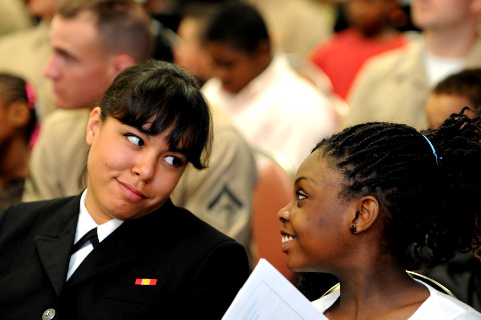 US Navy 110226-N-5328N-251 Information Systems Technician Seaman Stephanie Dasilva, a Saturday Scholar Mentor from San Jose, Calif., jokes with a s