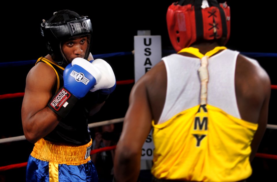US Navy 110218-N-2610F-172 Hospital Corpsman Brandon Wicker fights Army Spc. Jeffery Spencer for the gold medal in the final of the 178 lb. weight
