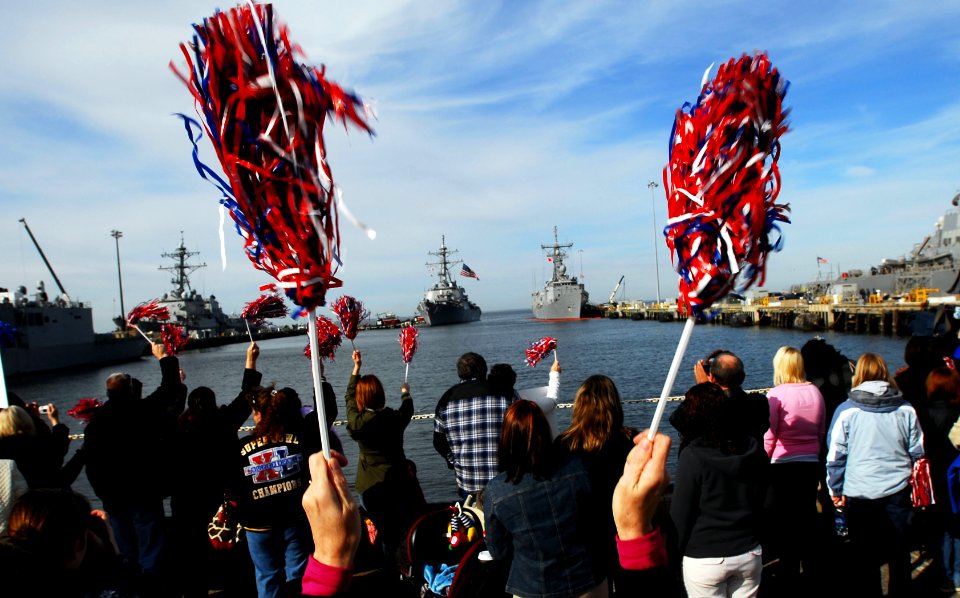 US Navy 110216-N-OS574-028 Family and friends wave as the guided-missile destroyer USS Laboon (DDG 58) arrives at homeport at Naval Station Norfolk