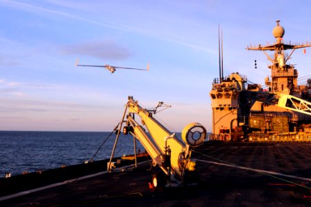 US Navy 110225-N-RC734-356 A Scan Eagle unmanned aerial vehicle (UAV) launches from the amphibious dock landing ship USS Comstock (LSD 45)