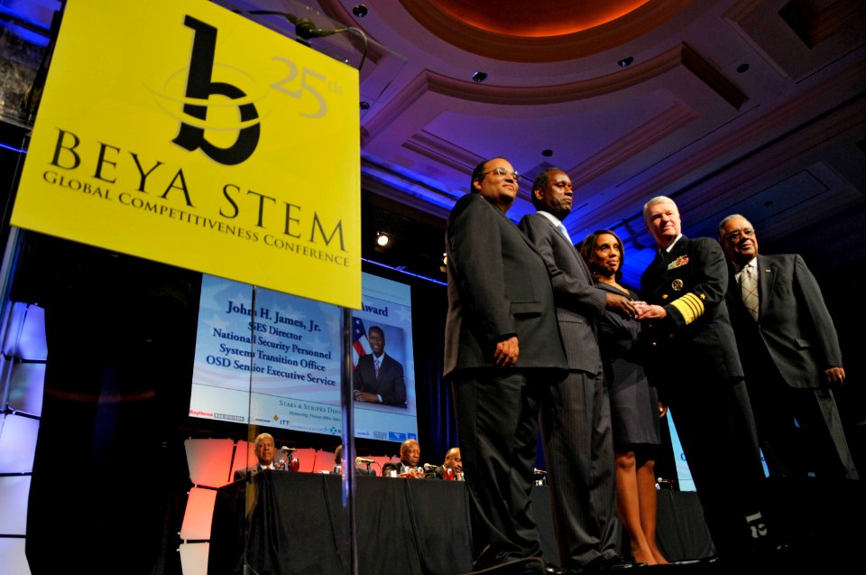 US Navy 110218-N-ZB612-055 Chief of Naval Operations (CNO) Adm. Gary Roughead presents John H. James, Jr., director of the National Security Person
