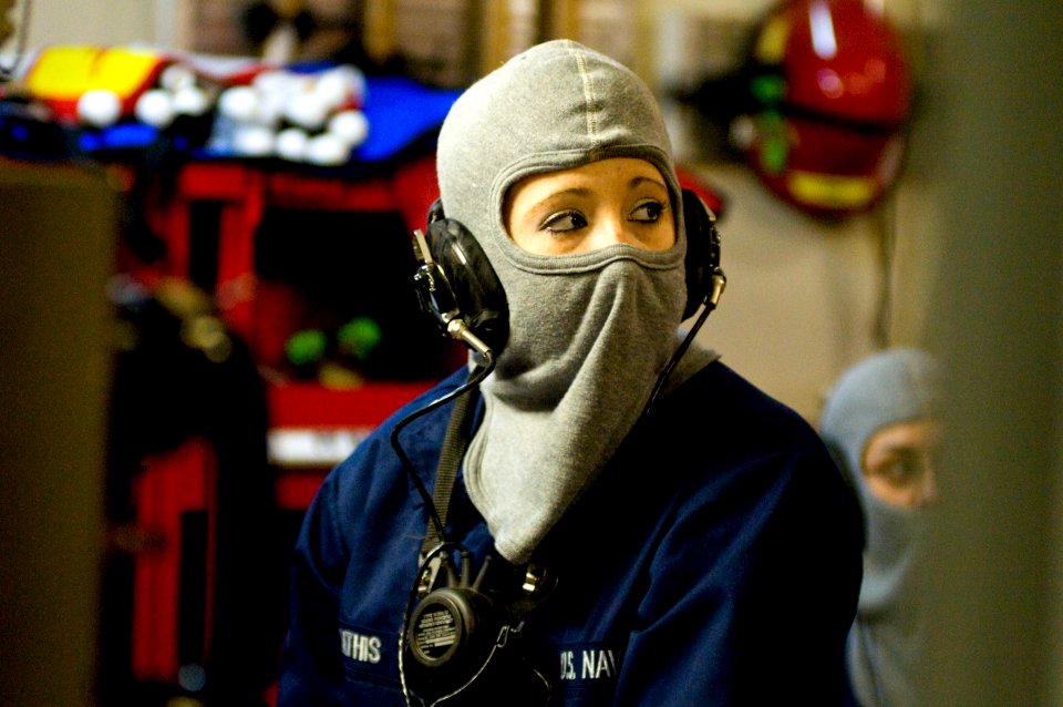 US Navy 110219-N-2953W-164 Hull Maintenance Technician Fireman Apprentice Amanda Mathis relays a message from Damage Control Central during a gener