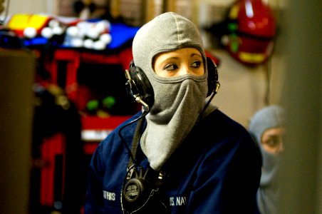US Navy 110219-N-2953W-164 Hull Maintenance Technician Fireman Apprentice Amanda Mathis relays a message from Damage Control Central during a gener