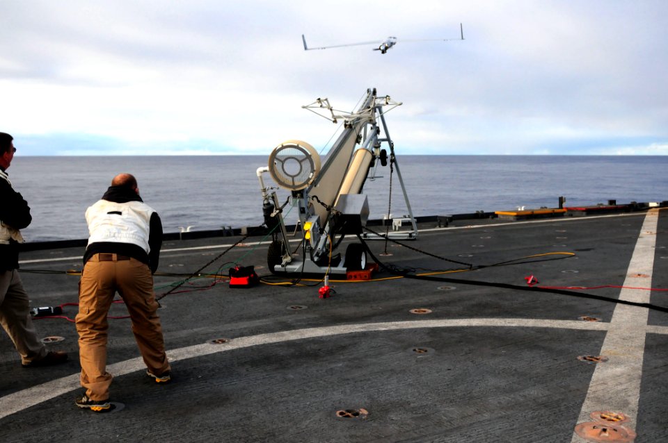 US Navy 110224-N-RC734-346 Guy Mcallister, from Insitu Group, launches the first Scan Eagle unmanned aerial vehicle from the flight deck of the amp