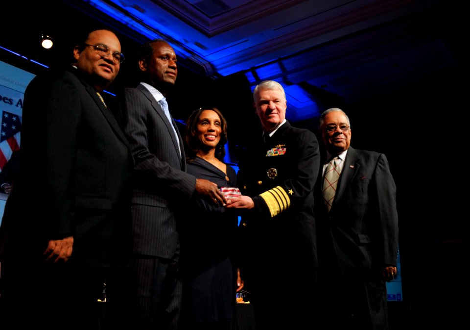 US Navy 110218-N-ZB612-052 Chief of Naval Operations (CNO) Adm. Gary Roughead presents John H. James, Jr., director of the National Security Person