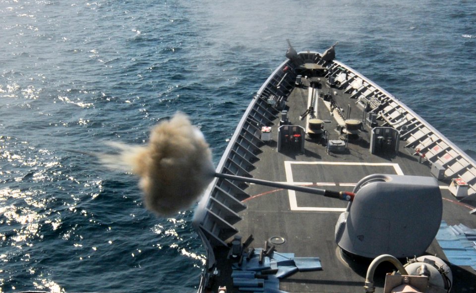 US Navy 110220-N-9793B-270 The guided-missile cruiser USS Anzio (CG 68) fires its forward 5-inch gun during a live-fire exercise