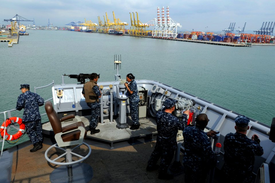 US Navy 110221-N-6692A-090 Sailors stand watch on the port bridge wing aboard the amphibious dock landing ship USS Germantown (LSD 42) as the ship