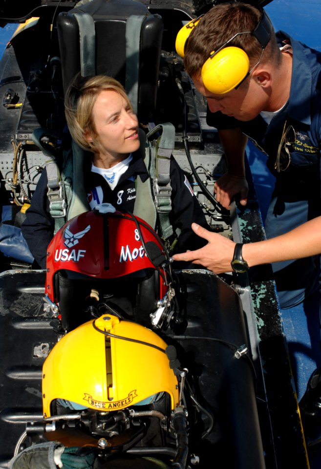 US Navy 110303-N-IR859-013 Crew Chief Aviation Structural Mechanic (Safety Equipment) 2nd Class Travis Simpson straps Capt. Kristin Hubbard into th