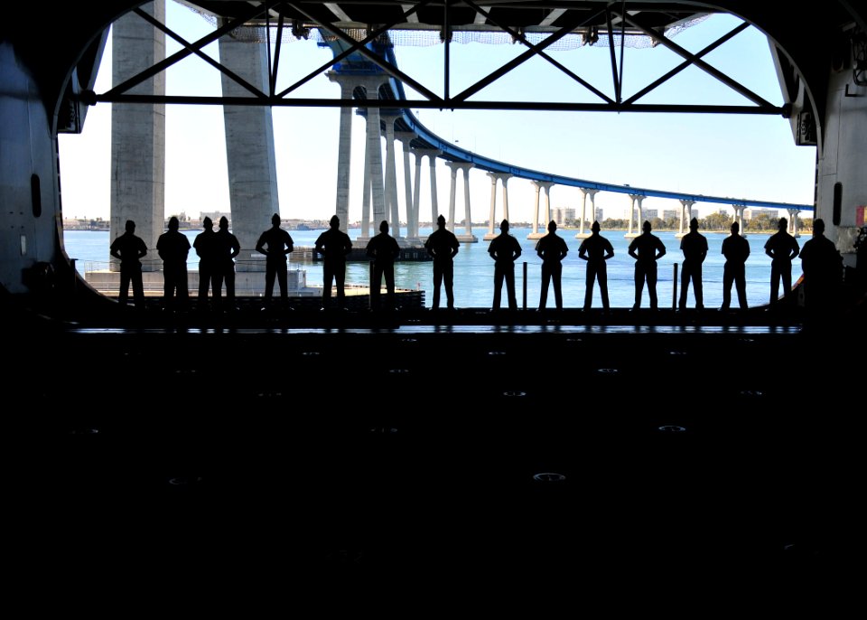 US Navy 110222-N-ZS026-153 Marines embarked aboard the amphibious assault ship USS Boxer (LHD 4) man the rails in the hangar bay of the ship