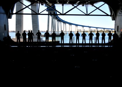 US Navy 110222-N-ZS026-153 Marines embarked aboard the amphibious assault ship USS Boxer (LHD 4) man the rails in the hangar bay of the ship