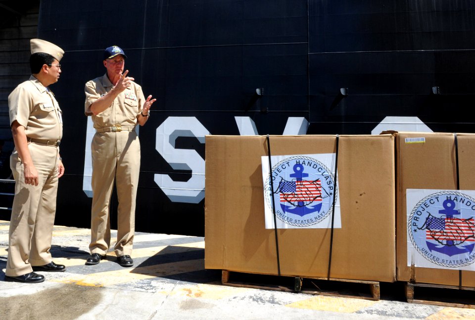 US Navy 110218-N-WX845-007 Cmdr. Mark Becker, right, speaks with Contralmirante Juan Antonio Calderon Gonzales