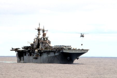 US Navy 110224-N-RC734-016 A CH-46E Sea Knight helicopter transfers ordnance from USS Boxer (LHD 4) during an ammunition onload