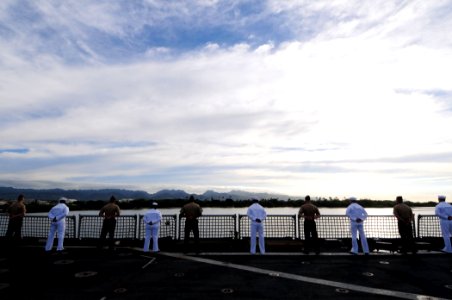 US Navy 110301-N-RC734-035 Sailors and Marines aboard the amphibious dock landing ship USS Comstock (LSD 45) man the rails as the ship makes a sche