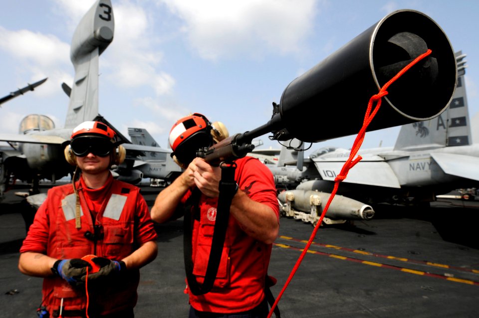 US Navy 110225-N-8040H-236 Sailors prepare to shoot a phone and distance line during a replenishment at sea