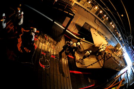 US Navy 110225-N-KD852-038 Sailors assigned to the deck department of the amphibious assault ship USS Makin Island (LHD 8) board Landing Craft Util