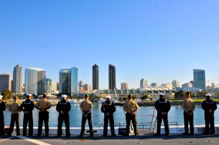 US Navy 110222-N-7042V-046 Sailors and Marines man the rails as the amphibious transport dock ship USS Green Bay (LPD 20) departs San Diego on its