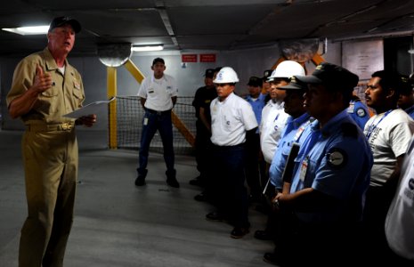 US Navy 110221-N-WX845-005 mdr. Mark Becker, left, gives a tour of High Speed Vessel Swift (HSV 2) to members of the El Salvador navy port security