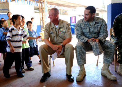 US Navy 110225-N-EC642-048 Cmdr. Mark Becker, mission commander of Southern Partnership Station 2011, center, and Air Force 1st Lt. Axel Zengotita