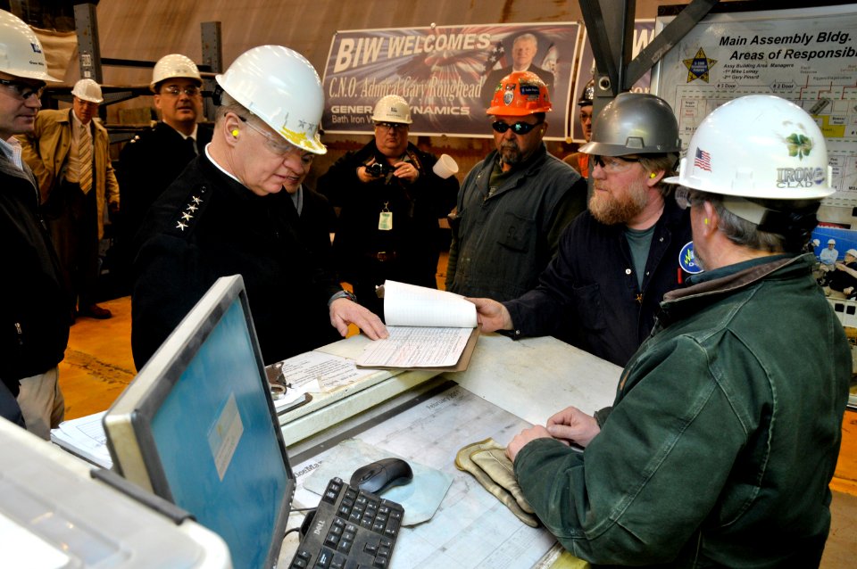 US Navy 110223-N-ZB612-063 Chief of Naval Operations (CNO) Adm. Gary Roughead speaks with employees working on Navy projects during a visit to Bath