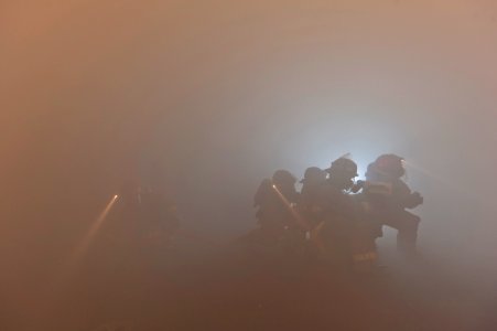 US Navy 110226-N-DR144-241 Sailors combat a simulated class bravo fire during a general quarters drill aboard USS Carl Vinson (CVN 70)