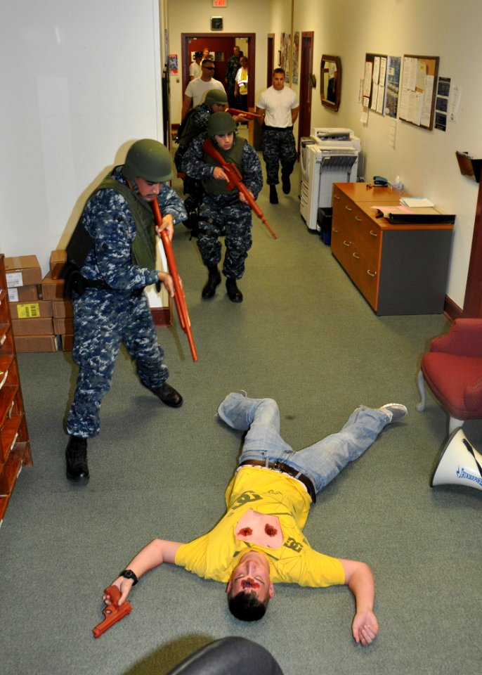 US Navy 110224-N-8241M-110 Master-at-arms assigned to the security department at Naval Station Guantanamo Bay, Cuba secure Master-at-Arms 3rd Class